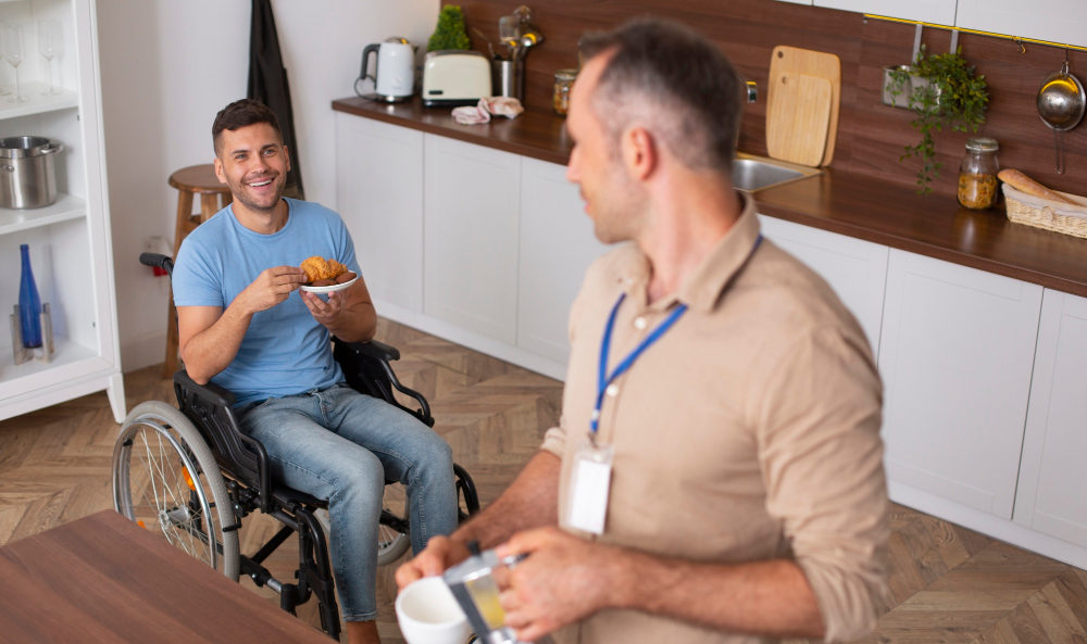 Health Support Worker Man Pouring Tea to NDIS Participant