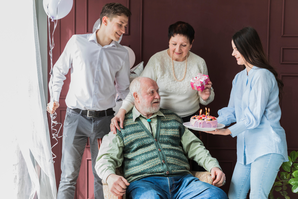 A Group of People, Including a Caregiver, Celebrates a Senior's Birthday in Aged Care