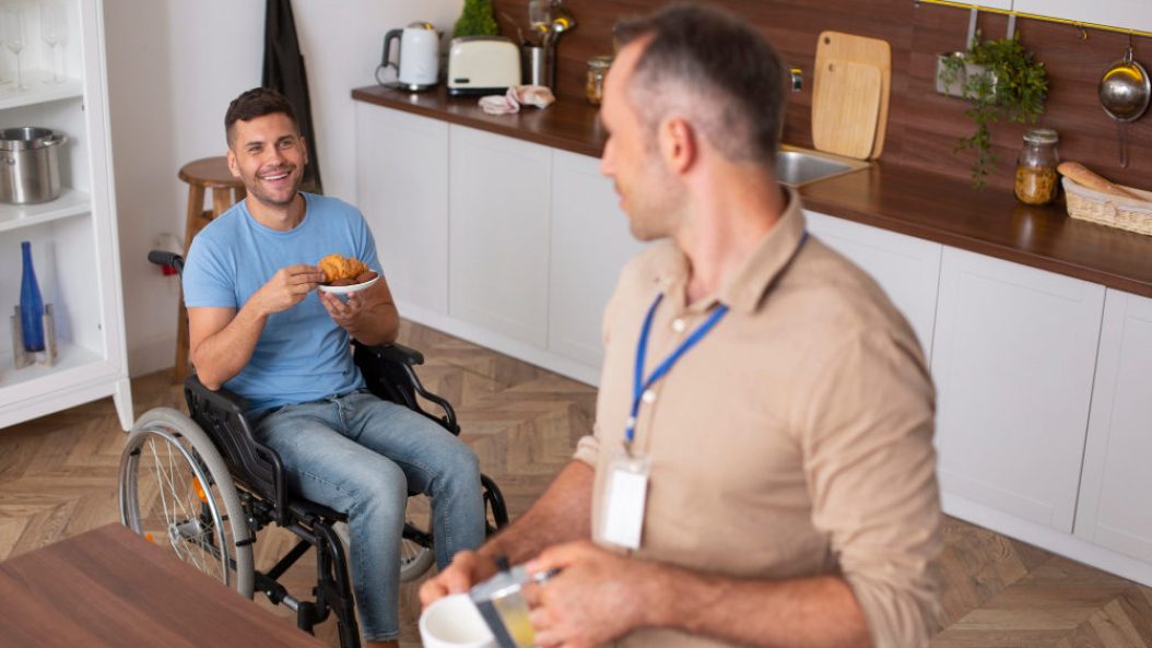 Health Support Worker Man Pouring Tea to NDIS Participant